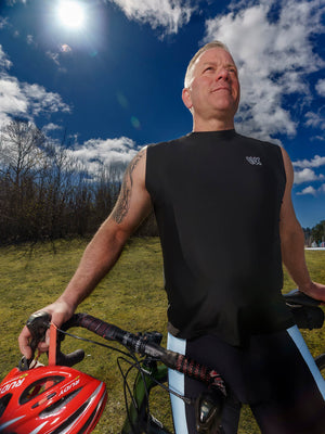 Men on a bike wearing Warrior Hill's original men's tank in black